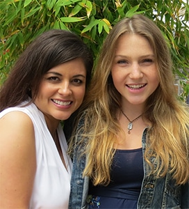 two women pose together